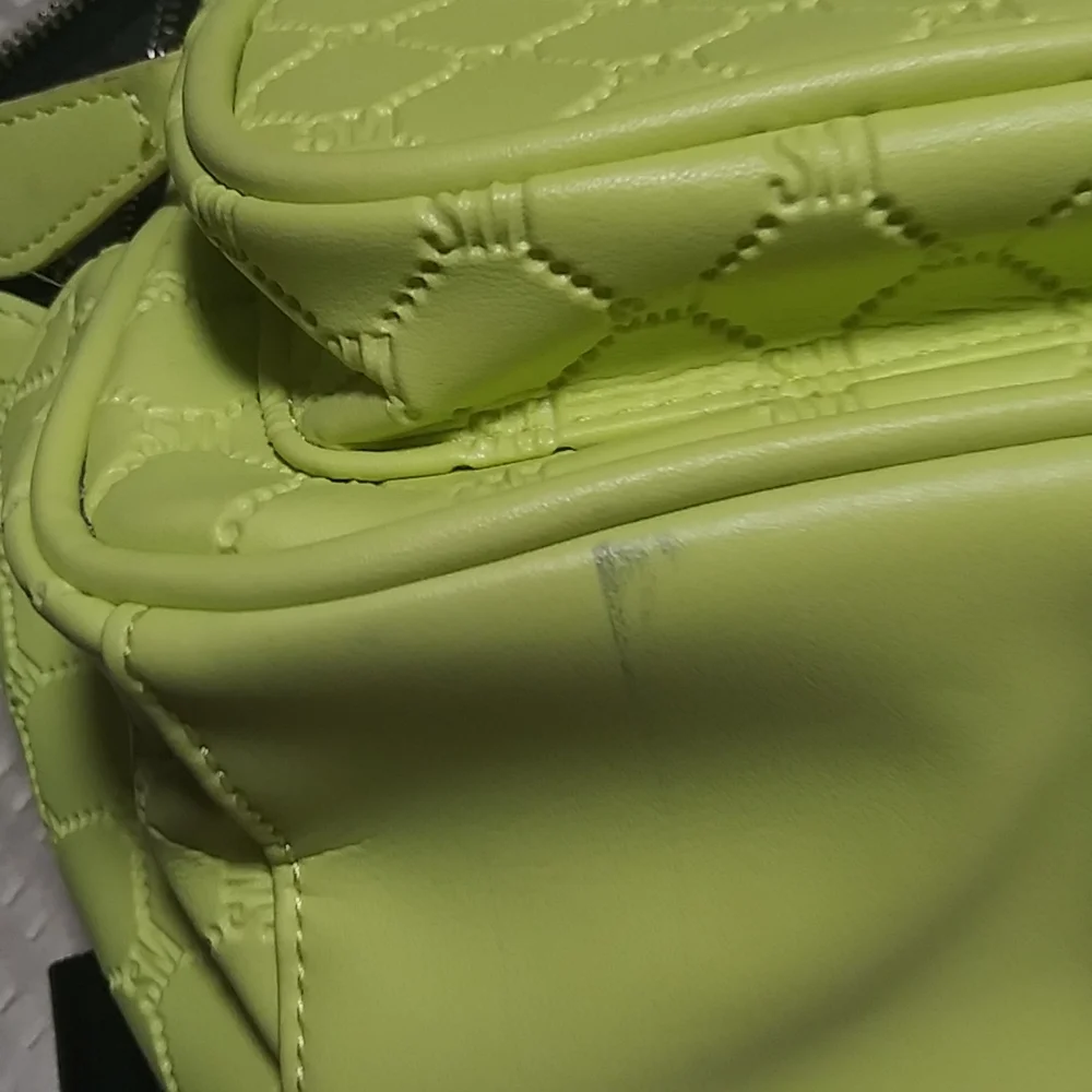 Steve madden neon backpack.